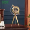 luxury decorative table clock with golden spherical design and triple base