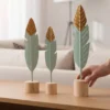 decorative feather trio on wooden bases