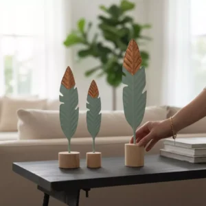 decorative feather trio on wooden bases