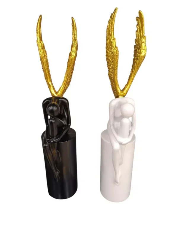 abstract angelic sculptures – black & white seated duo with golden wings abstract angelic sculptures – black & white seated duo with golden wings