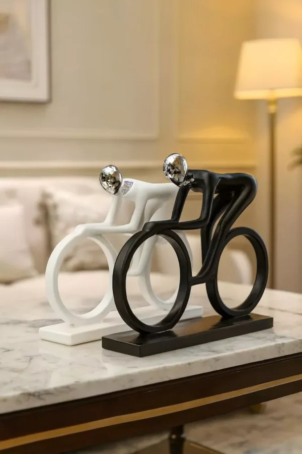 abstract-cyclist-sculptures-dynamic-black-white-duo-with-artistic-flow-00 Abstract Cyclist Sculptures – Dynamic Black & White Duo with Artistic Flow