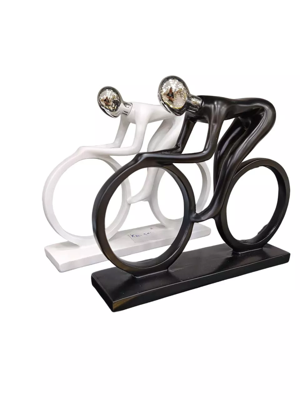 abstract cyclist sculptures – dynamic black & white duo with artistic flow abstract cyclist sculptures – dynamic black & white duo with artistic flow