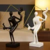 abstract sculptures in golden frame – artistic black & white duo with flowing motion