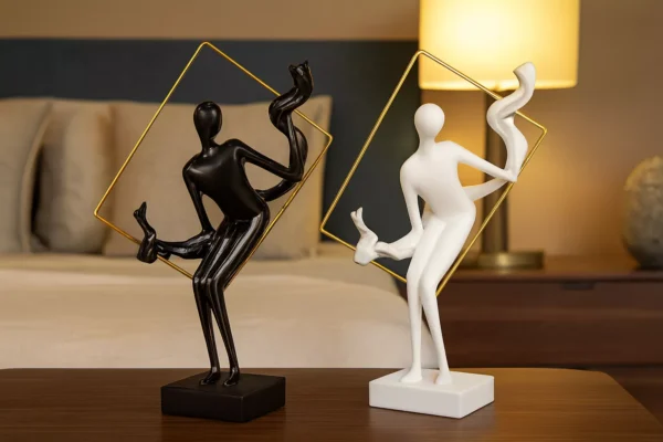 abstract sculptures in golden frame – artistic black & white duo with flowing motion abstract sculptures in golden frame – artistic black & white duo with flowing motion