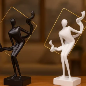 abstract sculptures in golden frame – artistic black & white duo with flowing motion