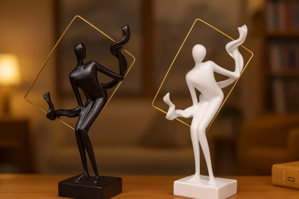 abstract sculptures in golden frame – artistic black & white duo with flowing motion abstract sculptures in golden frame – artistic black & white duo with flowing motion