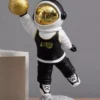 astronaut basketball sculpture – black & gold slam dunk on lunar base