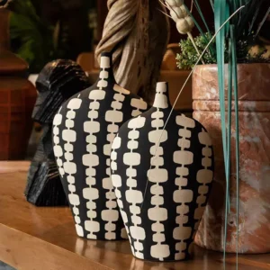 black ceramic vase duo with cream artistic motifs