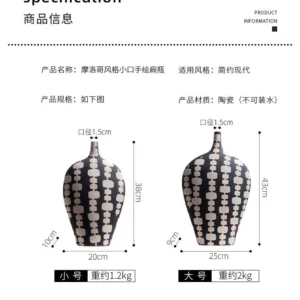 black ceramic vase duo with cream artistic motifs