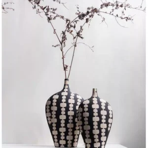 black ceramic vase duo with cream artistic motifs