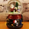christmas snow globe decoration – santa scene on snowy house base