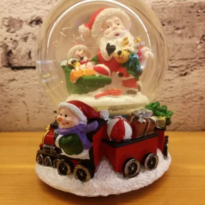 christmas snow globe – santa & child with gift train and whimsical winter charm