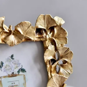 decorative photo frame with golden leaf design