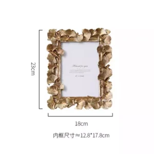 decorative photo frame with golden leaf design