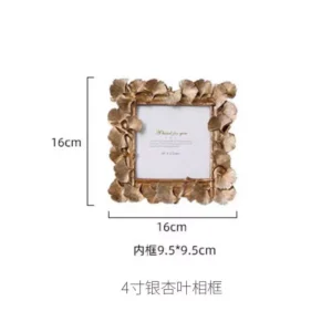 decorative photo frame with golden leaf design