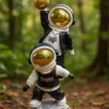 dual astronaut sculpture – playful black & white design with gold accents