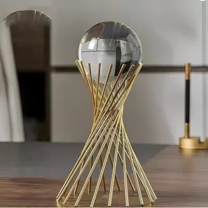 elegant glass sphere on twisted gold base – modern artistic decor