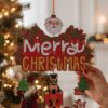 hanging christmas ornament with santa and classic figures