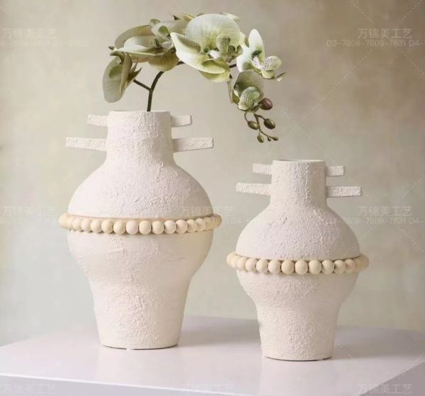 white ceramic vase duo with beaded accent white ceramic vase duo with beaded accent