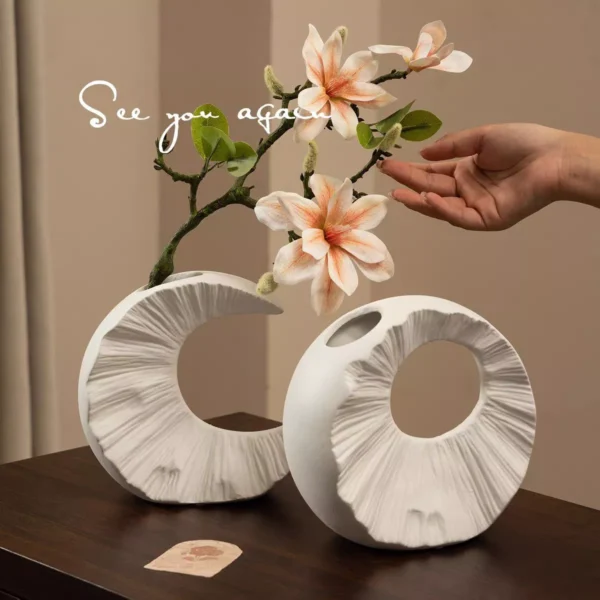 speckled white circular sculpture vase speckled white circular sculpture vase