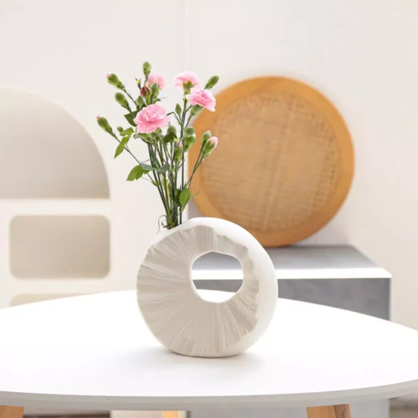 speckled white circular sculpture vase speckled white circular sculpture vase