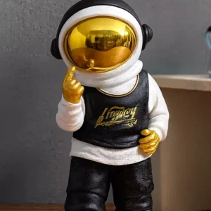 urban astronaut sculpture – black & white design with gold accents