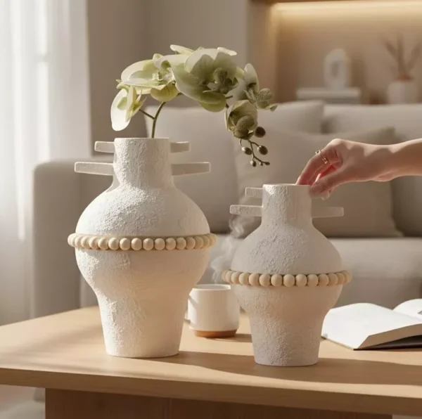 white ceramic vase duo with beaded accent white ceramic vase duo with beaded accent