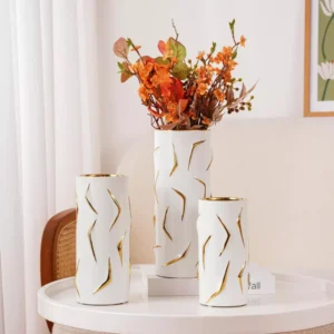 white ceramic vase trio with gold accents – modern contrast with artistic flair