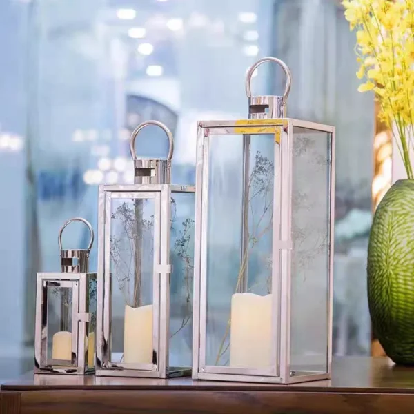 metal decorative lantern with rectangular base – 3 sizes – silver or gold finish, elegant design with clear glass and top handle metal decorative lantern with rectangular base – 3 sizes – silver or gold finish, elegant design with clear glass and top handle