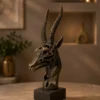 bronze antique gazelle head sculpture with cutout detail on black base